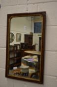 A 19th century walnut and gilt framed mirror.