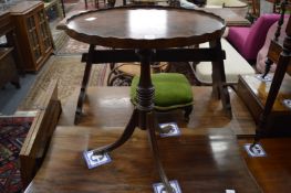 A mahogany tripod table.