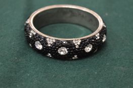 A decorative bangle.