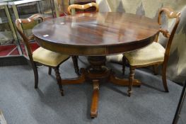A Victorian rosewood circular pedestal dining table.
