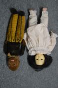 A felt toy figure, possibly by Norah Wellings together with a doll.