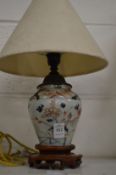 A Japanese Imari vase mounted as a lamp.