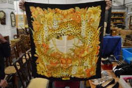 A Salvatore Ferragamo floral tiger design scarf.