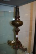 An Art Nouveau bronze and figural oil lamp with glass reservoir, signed Lanuit to the base,