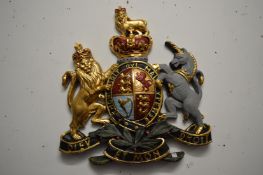 A decoratively painted plaster coat of arms.