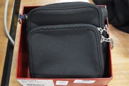 A Salvatore Ferragamo black fabric bag with box.