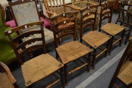 A set of four unusual 19th century ash and rush seated ladderback dining chairs.