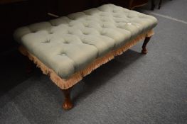 An upholstered stool.