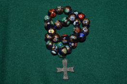 Worry bead necklace with crucifix.