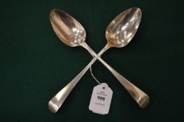 A pair of Georgian silver serving spoons.