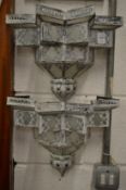 A pair of decorative wall mounted lantern shades.