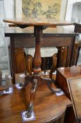 A 19th century mahogany circular tilt-top tripod table.