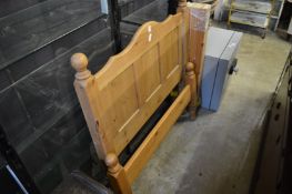 A pine single bed frame.