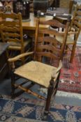 A 19th century rush seated elm rocking chair.