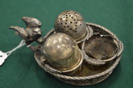 A novelty cruet set modelled as a bird with nest of eggs.