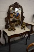 A rosewood and marble top serpentine shaped dressing table.