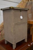 A Lloyd Loom style bedside or bathroom cabinet.