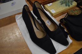 A pair of Unutzer black satin shoes, size 39½ with dust bag.