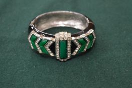 A Kenneth Lane gem set black and green vintage bangle.