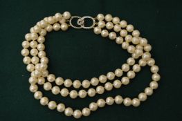 Large pearl necklace.