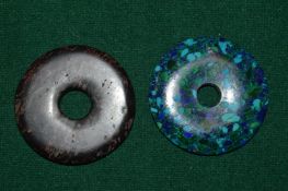 Two hard stone roundels.