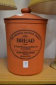A terracotta bread crock.