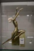 An Art Deco gilt metal figure of a dancer on an onyx base (hands damaged, figure reattached to