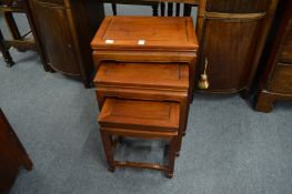 Chinese nest of three hardwood tables.