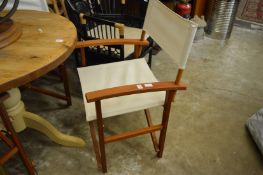 Three folding directors style chairs.