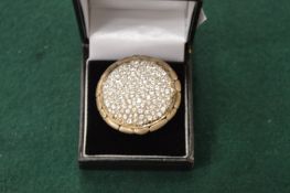 A large silver diamante ring.