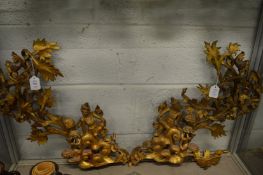A pair of Balinese carved and gilded wood brackets.