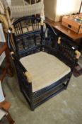Chinese style black lacquer bamboo conservatory armchair together with three wicker armchairs.