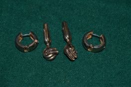 A pair silver earrings and cufflinks.