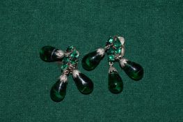 A pair of decorative earrings.