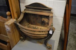 A Regency style cast iron fire grate.