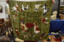 A Burberry scarf decorated with dogs.