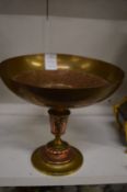 A copper and brass pedestal bowl.