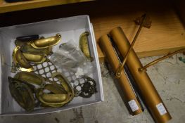 Brass door furniture and two picture lights.