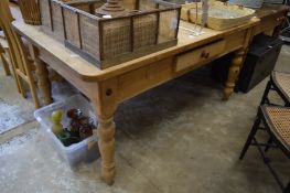 A good pine kitchen table with a draw to each side on turned legs.