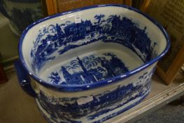 A reproduction blue and white foot bath.