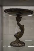 A plated centre piece, the cast base modelled as a dolphin.