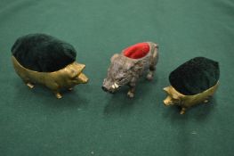 Two pig and a walrus pen wipes or pin cushions.