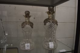 Two silver mounted hour glass decanters, 1903.