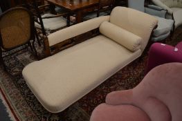 A Victorian walnut and upholstered chaise longue.