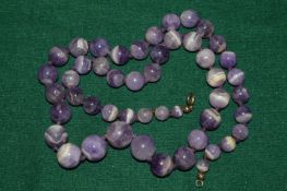 An amethyst necklace.