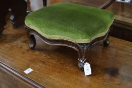 A small 19th century mahogany stool with cabriole legs.