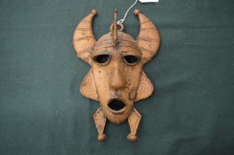 An African brass mask.