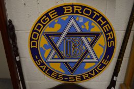 A reproduction Dodge Brothers Sales & Service circular enamel sign.
