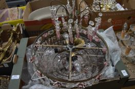 An ornate ormolu clear and coloured glass chandelier.