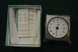 A Tiffany & Co clock, boxed.